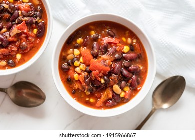 Vegetable Chili Bean Stew With Red Kidney Beans, Tomatoes, Sweetcorn, Red and Yellow Peppers On Flat Lay - Shutterstock ID 1915966867
