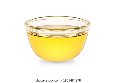 Vegetable cooking oil  in glass bowl isolated on white background.