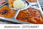 Vegetable curry or tarkari, papadam and dal bhat, part of an authentic traditional Indian thali set