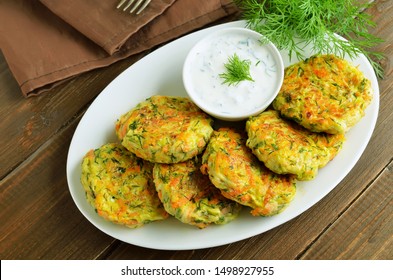 Vegetable Cutlet From Zucchini, Carrot, Herbs On Wooden Table