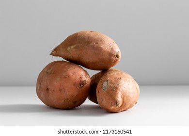 Vegetable, Food And Culinary Concept - Close Up Of Sweet Potatoes On Table