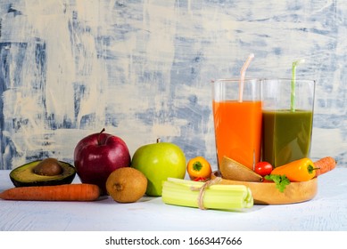 vegetable fruit smoothie in a glass with ingredients on the table
