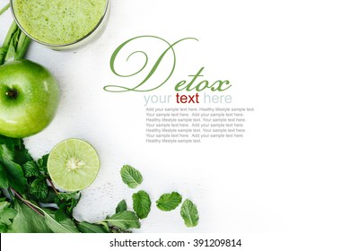 Vegetable juice, apple, sliced lime, leaves of mint and celery on the white wooden background. Detox