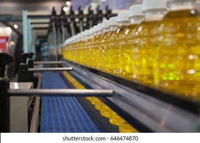 Vegetable Oil Bottles transfer on Conveyor Belt System - Powered by Shutterstock