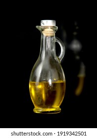 Vegetable Oil In A Glass Flask On A Black Background