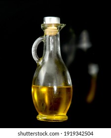 Vegetable Oil In A Glass Flask On A Black Background