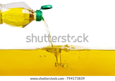 Vegetable oil pouring on vegetable oil background