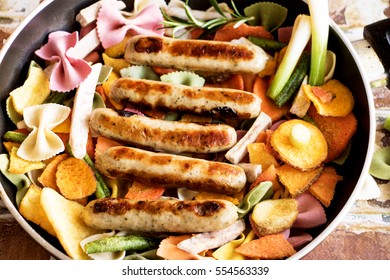 Vegetable pan with noodles and sausages
 - Shutterstock ID 554563339