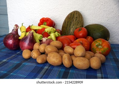 Vegetable patch harvest: onions, potatoes, peppers, tomatoes and melons - Shutterstock ID 2154228909