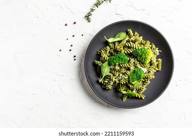 Vegetable Penne Pasta With Spinach On A Light Background. Banner, Menu, Recipe Place For Text, Top View.