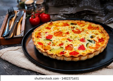 Vegetable Pie With Cherry Tomatoes, Grilled Peppers And Courgettes With Fresh Eggs And Fresh Cream