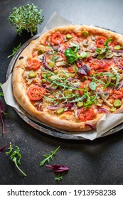 vegetable pizza tomato, onion, pickles, mushrooms vegan or vegetarian no meat portion on the table healthy meal snack outdoor top view copy space food background rustic 
