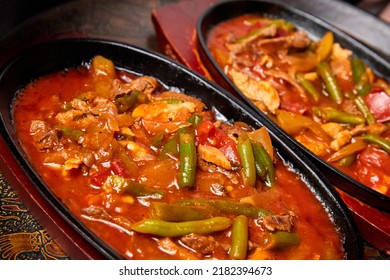 Vegetable Ragout With Pork Pieces In A Cast Iron Dish