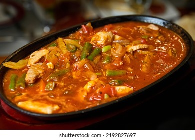 Vegetable Ragout With Pork Pieces In A Cast Iron Dish