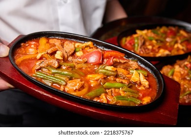 Vegetable Ragout With Pork Pieces In A Cast Iron Dish