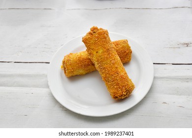 Vegetable Roll, Chicken Roll, Beef Roll, Egg Roll, Made By Deep Fide Crispy Layer Arranged In A White Ceramic Dish With White Paint Wooden Background, Isolated.