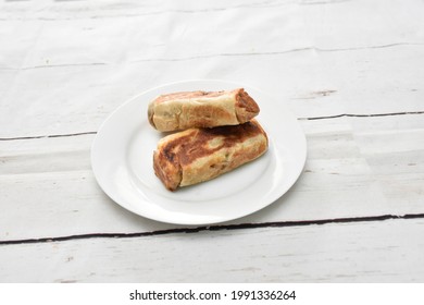 Vegetable Roll, Chicken Roll, Beef Roll, Egg Roll, Made By Deep Fide Crispy Layer Arranged In A White Ceramic Dish With White Paint Wooden Background, Isolated.