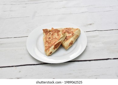 Vegetable Roti Or Roll, Chicken Roti Or Roll, Beef Roti Or Roll, Egg Roti Or Roll, Made By Paratha. Arranged In A White Ceramic Dish With White Paint Wooden Background, Isolated.