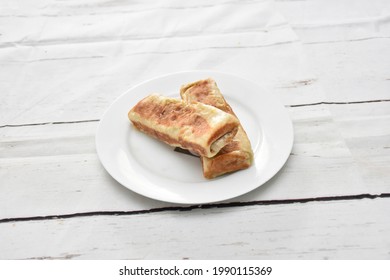 Vegetable Roti Or Roll, Chicken Roti Or Roll, Beef Roti Or Roll, Egg Roti Or Roll, Made By Paratha. Arranged In A White Ceramic Dish With White Paint Wooden Background, Isolated.