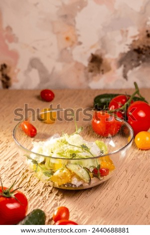 Vegetable Salad Bowl with Tomatoes, Cucumbers, Lettuce, Carrots, Greens
