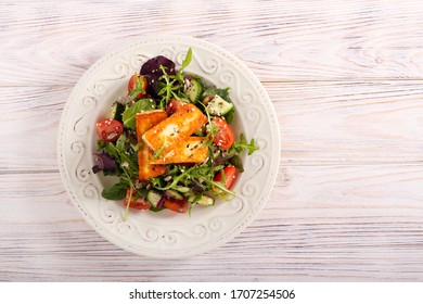 Vegetable Salad With Fried Halloumi Cheese On Plate