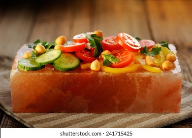 Vegetable Salad On Pink Salt Block