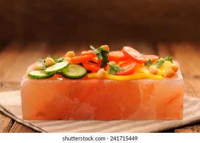 Vegetable Salad On Pink Salt Block