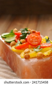 Vegetable Salad On Pink Salt Block