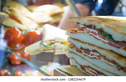 Vegetable Sandwich With Tomato And Lettuce On A Counter In An Italian Coffee Shop