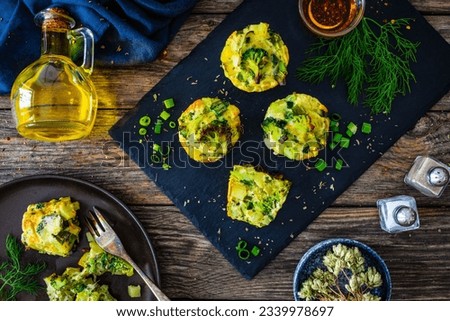 Vegetable savory muffins on wooden background