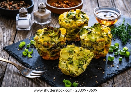 Vegetable savory muffins on wooden background