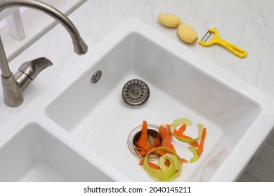 Vegetable Scraps In Kitchen Sink With Garbage Disposal, Above View