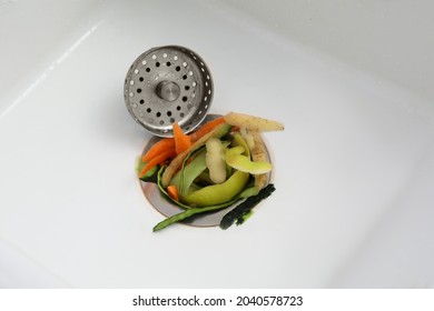 Vegetable Scraps In Kitchen Sink With Garbage Disposal