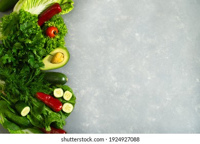 Vegetable set with green and red products on a gray background with space for menus or diet records