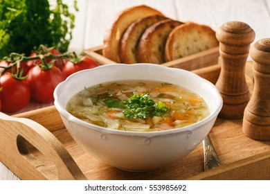 Vegetable Soup With Bread On Wooden Tray. 