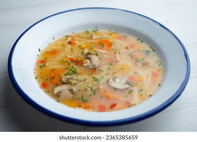 Vegetable soup with leeks, mushrooms, carrots, peppers and noodles. - Shutterstock ID 2365385659