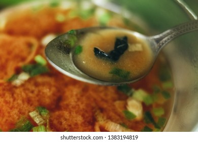 Vegetable Soup, Shot Close Up, You Can See Pieces Of Vegetables In A Spoon, In A Transparent Plate