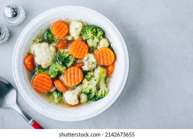 Vegetable Soup. Spring Broccoli, Cauliflower, Carrots Soup In Bowl. Top View, Copy Space