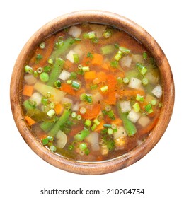 vegetable soup in wooden bowl. top view