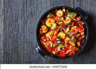 Vegetable Stew, Eggplant, Onion, Zucchini With Tomato Sauce, Garlic And Herbs In A Baking Dish On A Wooden Table, Landscape View From Above, Close-up, Flat Lay, Free Space