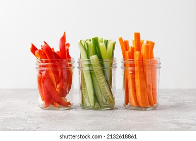 Vegetable sticks in jar. Healthy and diet food concept. Carrot, bell pepper, paprika, cucumber