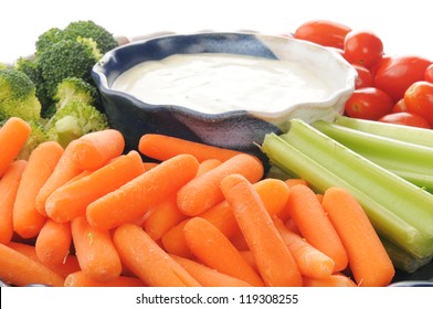 A Vegetable  Tray With Ranch Dressing Closeup