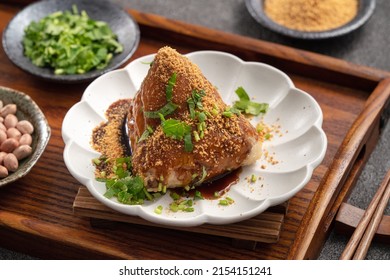 Vegetable zongzi. Vegetarian rice dumpling for traditional Chinese Duanwu Dragon Boat Festival food with glutinous rice, peanuts, and coriander.