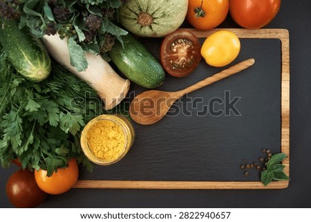 Vegetables dark background with copy space. Healthy meal. Menu, price background. Vegetables on black chalkboard.