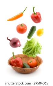 Vegetables Falling Into Dish