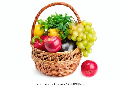 Vegetables and fruits in a basket isolated on white .
