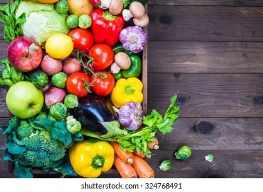 Vegetables and fruits in box copy space background.Delivery service local market organic food. - Powered by Shutterstock