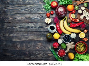 Vegetables And Fruits On A Dark Rustic Wooden Table. Healthy Vegetarian Food.