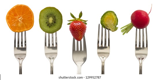 vegetables and fruits on the forks, diet concept