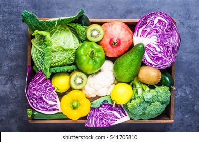 Vegetables And Fruits In Wooden Box Top View.